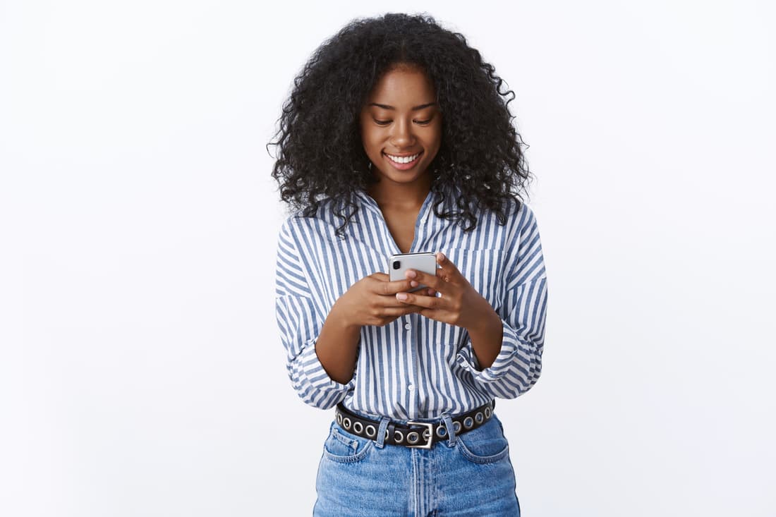 Woman using the Symptom Spectrum diagnostic app on her smartphone